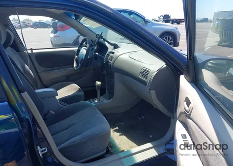 2002 Toyota Corolla Le из США, поврежденный, VIN 2T1BR12E52C558044